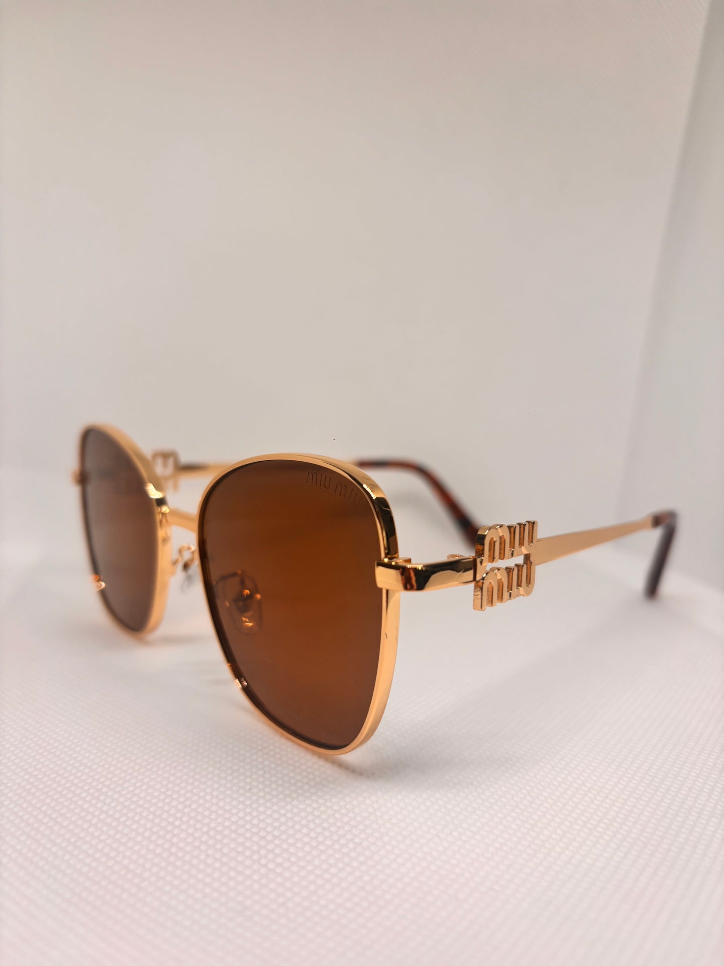 GOLD AND BROWN MIU