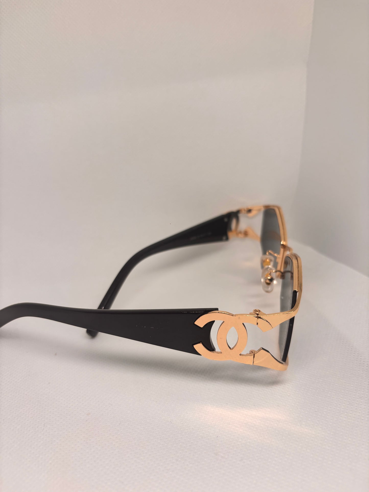C BLACK AND GOLD SUNGLASSES